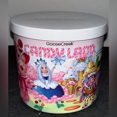 a close up of a plastic container with candy land designs on it's lid