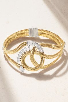 Nikos Koulis won the Couture Design Awards in the Gold category for his 2019 'Feelings' collection – the jeweler has since become a judge of the prestigious competition. This bracelet is crafted using an 18-karat gold snake chain to convey a sense of fluidity and encrusted with baguette and round-cut diamonds in contrasting white gold bezel settings. Luxury Baguette Diamond Bracelets, Luxury Bracelets With Baguette Diamonds, Luxury Flexible Gold Bracelet For Formal Occasions, Luxury Flexible Gold Diamond Bracelet, Luxury Baguette Diamond Bangle Jewelry, Luxury Flexible Yellow Gold Diamond Bracelet, Luxury Baguette Diamond Bangle, Designer Gold Jewelry With Baguette Diamonds, Designer White Gold Bracelet