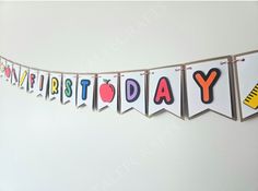 a happy birthday banner hanging on the wall