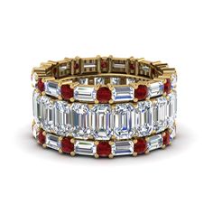 The emerald cut eternity band with matching baguette and round bands showcases excellent quality emerald cut diamonds vertically placed in one band whereas, a sparkling sequence of horizontally set baguette diamonds and round cut diamonds in other two bands brings in a captivating effect. The emerald cut diamond eternity band is incarcerated with a pristine series of horizontally placed emerald cut diamonds of 4.20 carat total weight, VS2 clarity and H color in prong setting. Alternate sequence of round cut diamonds of 0.72 carat total weight, SI2 clarity, G color and baguette diamonds of 1.68 carat total weight, VS2 clarity and G color beautifies the other two bands in prong setting. Total number of diamonds - 69. Total carat weight – 6.60 CTW. This trio wedding bands can also be ac Wedding Bands Stacked, Emerald Cut Diamond Eternity Band, Emerald Cut Eternity Band, Wedding Rings Emerald Cut, Blue Wedding Rings, Ruby Wedding Band, Ruby Wedding Rings, Stacked Rings, Stacked Wedding Bands