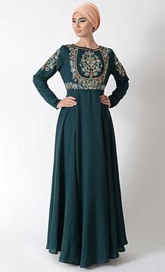 Featuring a traditional modest wear abaya dress in polyester moss crepe fabric adorned with floral thread, dabka and zardozi applique work on the front bodice and sleeves. It is slightly fitted around the waist for fit and flared look to an ensemble along with pleated panels all over the flared bottom skirt.FIT : Relaxed fit.COMPOSITION : Polyester moss crepe.CARE : Dry clean only. Matching Abaya color plain hijab 20" x 70" included Applique Work, Color Plain, Abaya Dress, Modest Wear, Crepe Fabric, Bodice, Composition, Dry Clean, Thread