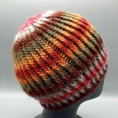 a multicolored hat on a mannequin head