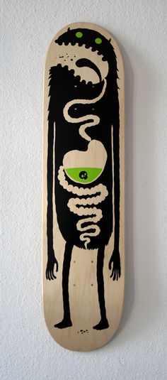 a skateboard with an image of a creature on it