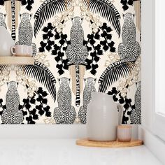 the wallpaper is decorated with black and white flowers