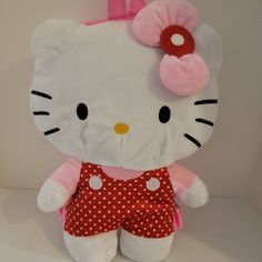 a hello kitty stuffed animal with polka dot shorts