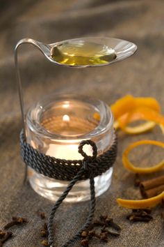 a glass jar filled with liquid sitting on top of a table