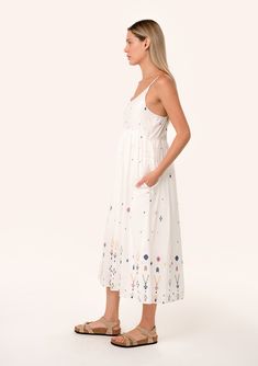 A classic sleeveless white bohemian midi dress made with multi-colored embroidered details throughout. Cotton Embroidered Relaxed fit Sleeveless Mid-length Scoop neckline Adjustable spaghetti straps Side pockets Lined Bohemian summer dress Multi-colored embroidered details add a charming touch to this classic bohemian summer midi dress. With adjustable spaghetti straps, a flattering scooped neckline, and essential side pockets. Model is 5'9, wearing a size S.Style: I-73336WL-SJX Embroidered Midi Length Maxi Dress For Summer, Summer Floral Embroidered Midi Dress, Casual Embroidered Midi Dress For Spring, Sleeveless Dress With Multicolor Embroidery For Spring, Spring Midi Length Sundress, Unlined, Summer Midi Dress With Floral Embroidery, Spring Midi Length Unlined Sundress, White Midi Dress With Adjustable Straps, Unlined Spring Sundress