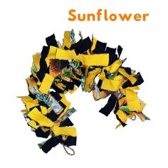 a yellow and black flower with the words sunflower on it