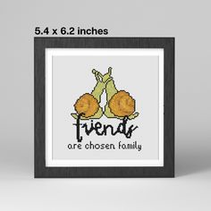 a cross stitch picture frame with the words friends are chosen family in black and white