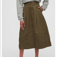 This Gap Amber Green High Rise Khaki Midi Skirt Is Adorable And Suitable For All Seasons! 28” 28.5“ Waist Size 4 >>>Fits Like 4-6. Banded Waist With Button-Closure, Zip Fly Front Slant Pockets 100% Cotton Machine Wash Imported Please Note: Details Including Fabric, Construction, And Measurement Are Subject To Slight Variations From The Pictured Item. Open To All Serious Offers Please Review All Images. No Returns. Listed Item Only. Accessories Not Included. See My Closet For More Great Brands & Casual Lined Skirt Bottoms By Gap, Casual Cotton Skirt By Gap, Gap Casual Cotton Skirt, Spring Cotton Skirt By Gap, Khaki Midi Skirt, Olive Green Skirt, Fabric Construction, Green Skirt, Lovely Things