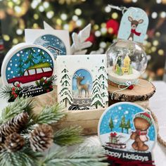 christmas cards and ornaments on a table