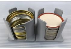 a stack of silver and gold plates in a holder