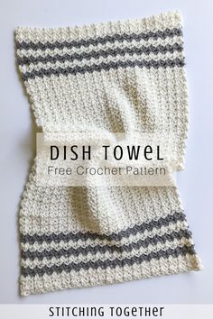 the dish towel is crocheted in white and gray yarn