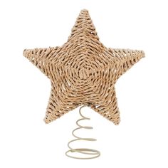 a wicker star decoration hanging from a wire on a white background with spirals