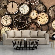 a living room with lots of clocks on the wall