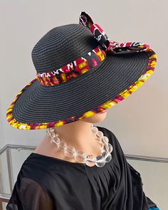 ombines timeless elegance with vibrant cultural flair. Handcrafted with care, this hat features a beautifully woven straw base adorned with bold African print fabric, offering both style and sun protection. Perfect for church services, outdoor events, or simply adding a touch of sophistication to your outfit, this hat blends tradition with modern design. Lightweight and breathable, it's as comfortable as it is striking. Elevate your look with a hat that celebrates heritage and craftsmanship. One size: should fit all. Summer Fedora Sun Hat For Church, Summer Races Flat Brim Straw Hat, Summer Races Straw Hat With Flat Brim, Multicolor Flat Brim Sun Hat For Kentucky Derby, Brimmed Straw Hat For Summer Races, Multicolor Sun Hat For Beach And Kentucky Derby, Summer Flat Brim Straw Hat For Races, Black Handwoven Straw Hat With Curved Brim, Summer Brimmed Straw Hat For Races