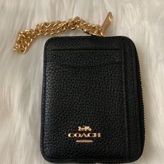 Coach Pebble Leather Zip Card Case *New With Tags *Black Pebble Leather Exterior *Blackleather Interior *Exterior: (3) Card Slots, (1) Clear Id Window Slot *Side Zip Closure, Gold-Tone Hardware *Gold-Tone Chainlink Wrist Strap *Approximate Dimensions: 4.25" X 3" X 0.75" Coach Leather Bags With Card Slots, Black Leather Compact Coin Purse, Compact Black Leather Coin Purse, Elegant Gold Coach Coin Purse, Chic Leather Card Holder For Everyday, Coach Leather Coin Purse With Coin Pocket, Chic Coach Coin Purse With Card Slots, Coach Leather Wallets With Zipper Closure, Coach Leather Coin Purse