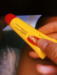 a person holding a yellow marker in their right hand with the word flux written on it