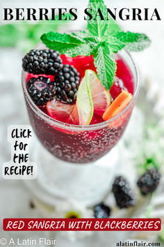 berries sangria in a glass with mint garnish