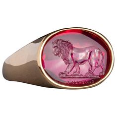 Chushev Lion Man Made Corundum Intaglio Gold Signet Ring | From a unique collection of vintage Signet Rings at https://www.1stdibs.com/jewelry/rings/signet-rings/. Luxury Formal Signet Ring With Intaglio, Luxury Carved Yellow Gold Signet Ring, Elegant Red Intaglio Signet Ring, Luxury Round Signet Ring With Intaglio, Luxury 14k Gold Signet Ring With Intaglio, Luxury Engraved Ruby Ring, Luxury Oval Signet Ring With Intaglio, Luxury Carved Oval Signet Ring, Elegant Oval Ruby Ring With Intaglio