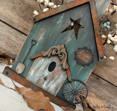 a birdhouse with a star on the roof