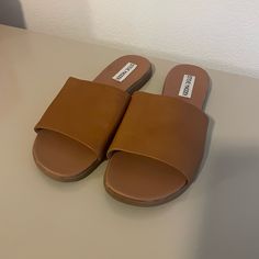 These Sandals Have Never Been Worn Other Than To Try On. There Is Slight Scratch On Right Sole Pictured From Storage, But Upper And Bottoms Are Clean. Leather Mules With Round Toe For Day Out, Leather Round Toe Mules For Day Out, Brown Closed Toe Slides For Spring, Brown Flat Heel Sandals For Day Out, Leather Slide Sandals For Day Out, Brown Flat Sandals For Day Out, Brown Flat Heel Slides For Spring, Brown Open Heel Slides For Spring, Trendy Round Toe Sandals For Brunch