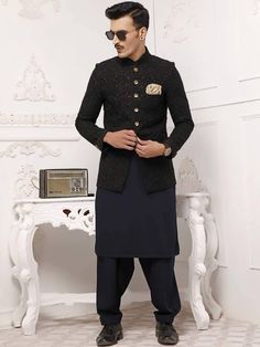 <p>Color: Black<br />Fabric: Jamawar<br />Stylish prince coat features rich quality embellishments accentuate on the collar, sleeves, front and all over<br />Fancy button closure<br />Complement with Payne's grey kurta and shalwar</p> <p><strong>Additional Accessories:</strong> </p> <p><strong>Plain Kolhapuri/Saleem Shahi shoes:</strong> US$30 (Made with prince coat material)</ Grey Kurta, Prince Coat, Wedding Dresses Indian, Wedding Dress Outfit, Fancy Buttons, Pakistani Wedding Dresses, Indian Wedding Dress, Pakistani Wedding, Suits Coats