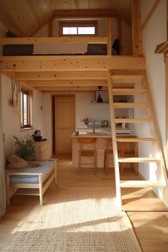 there is a loft bed in the middle of this room with stairs leading up to it