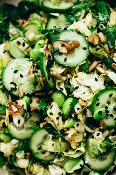 a salad with cucumbers, green beans and nuts