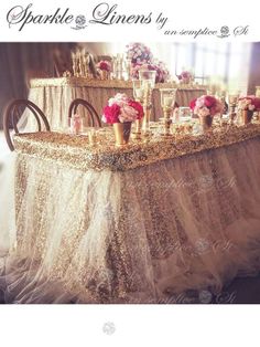 the table is covered with gold sequins and pink flowers