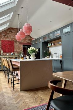 an image of a kitchen with lots of counter space and chairs on it's side