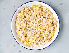 a bowl filled with corn salad on top of a table