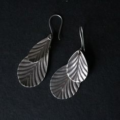 Sterling silver leaf design dangle earrings Approximately H 2.25 X W 1 inches Unique Silver Hypoallergenic Earrings, Nature-inspired Silver Teardrop Jewelry, Silver Teardrop Earrings With Oxidized Finish As Gift, Unique Silver Teardrop Dangle Earrings, Nickel Free Silver Leaf Shaped Jewelry, Silver Teardrop Earrings With Oxidized Finish, Unique Silver Dangle Teardrop Earrings, Handmade Silver Leaf Jewelry, Nature-inspired Silver Dangle Jewelry