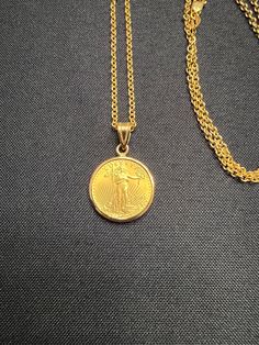 Each piece is custom made when ordered. Takes 2-4 weeks from order to delivery. Bezel is 14K with prong backs in either diamond cut or smooth design. Coin is 22k gold. Chain is a 20" 2mm thick cable solid gold chain. 14k Gold Coin Jewelry Stamped 14k, 22k Yellow Gold Medallion Jewelry, Gold Jewelry With Bezel Setting In Recycled Gold, Luxury Tarnish Resistant Coin Jewelry, 22k Gold Tarnish Resistant Round Pendant Jewelry, 22k Gold Round Pendant Jewelry Tarnish Resistant, Classic Jewelry With Bezel Setting In Recycled Gold, Tarnish Resistant 22k Gold Round Pendant Jewelry, Classic Jewelry In Recycled Gold With Bezel Setting