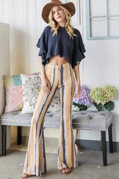 This item is Final Sale.  Boho babe! The Aeryn High Rise Striped Flares in Yellow Multi are the perfect pants for the summer! These high waisted pants feature a fitted silhouette that flares out at the bottom. The yellow, gray, and navy abstract striped pattern make these pants super unique. Pair with a navy crop top and an oversized floppy for the perfect boho look! Striped Flare Pants, Navy Crop Top, Printed Flare Pants, High Rise Style, Perfect Pant, Boho Look, Country Outfits, Fitted Silhouette, Stripe Print