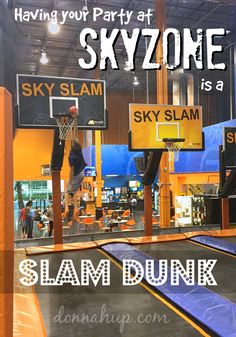 an indoor basketball court with the words skyzone is a slam dunk on it