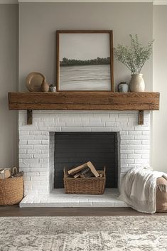 a living room with a white brick fireplace