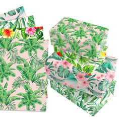 three boxes with tropical print on them and one has flowers in the middle, while the other