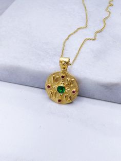 Constantine Solid Gold Coin Pendant with Emerald and Ruby. A Byzantine Handmade ICXC NIKA Charm from 14k Yellow Solid Gol  with Natural precious stone - set with a central Emerald stone of 0.28carats and diameter 4.15mm and 4 Ruby. An ideal choice for a NewBorn Babies protection gift or as a baptismal gift. But also as a special and unique piece of jewelry that you can wear every day.   Details: Charm Size: diametre 18mm Weight: 14k 4.8gr Metal: 14k Yellow Gold Gem Stone: Emerald 0.28ct ❣️ For more  Constatine charm take a look here      👉  https://www.etsy.com/shop/GiorgosJewelry?ref=seller-platform-mcnav&section_id=23772595 🎁 All of our jewelry come in specially hand packaged gift boxes        so they are ready for great gift giving! 📞 Please fill in your order a mobile phone number f Handmade Byzantine Necklace For Ceremonial Use, Handmade Byzantine Ceremonial Necklace, Handmade Byzantine Style Ceremonial Necklace, Handmade Green Byzantine Jewelry, Handmade Byzantine Round Necklace, Handmade Byzantine Style Necklace, Gold Coin Jewelry, Emerald Style, Baby Protection