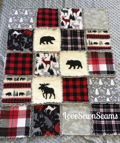 a quilted blanket with black and red animals on it