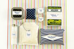 an assortment of items are displayed on a striped tablecloth, including soap, toothpaste and other personal care products