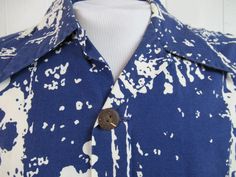 "Vintage 1960s Hawaiian shirt. Made of blue and white cotton. Shirt has a button down front, coconut buttons and a single pocket. Made in Hawaii by Tahiti Imports. Size large. Actual measurements are: 44\" at the chest 43\" at the waist 17.5\" shoulder seam to shoulder seam 29.5 overall length In very good condition." Retro Blue Button-up Hawaiian Shirt, Blue Retro Hawaiian Button-up Shirt, Blue Cotton Hawaiian Shirt With Buttons, Summer Shirt With Covered Buttons And Collared, Cotton Button-up Hawaiian Shirt, Retro Collared Hawaiian Shirt With Button Closure, Vintage Beach Shirt With Buttons, Vintage Buttoned Shirt For Beach, Vintage Blue Button-up Hawaiian Shirt