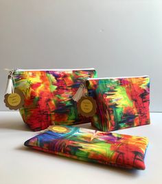 Bright, colorful, groovy makeup back; multicolored fabric pouch; vibrant and colorful, multi purpose pouch; fun and fashionable pouch by Francescasflair on Etsy Groovy Makeup, Fabric Pouch, White Tassel, Toiletry Storage, Makeup Essentials, Cosmetic Bags, Fit In, Cosmetic Bag, Makeup Bag