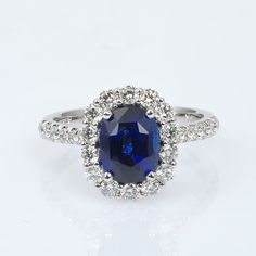 This natural Sri Lankan Sapphire has a deep unmatched royal blue color. Cut to maximize its color from the rough, this oval gem has been set amongst diamonds to bring just the right amount of brightness to the ring. It’s the perfect ring to pop the big question. Order online info@jupitergem.com Luxury Sapphire Diamond Solitaire Ring, Classic Luxury Sapphire Ring With Single Cut Diamonds, Luxury Classic Sapphire Ring With Round Cut, Luxury Solitaire Sapphire Ring For Formal Occasions, Luxury Round Cut Sapphire Wedding Ring, Luxury Classic Sapphire Ring For Wedding, Luxury Classic Blue Sapphire Ring, Luxury Classic Royal Blue Ring, Luxury Sapphire Ring In Sterling Silver With Prong Setting