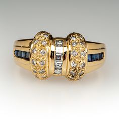 a gold ring with blue and white stones on it's sides, set in 18k yellow gold