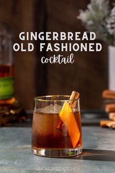 Gingerbread Old Fashioned cocktail in an old fashioned style glass. The drink is brown and has a large sphere of ice in the glass along with an orange peel and a cinnamon stick garnish. In the background to the left is a bottle of Bulleit rye whiskey, and to the right is a vase with snowy looking evergreens with a stack of wooden coasters under the vase. Text overlay above the cocktail reads “Gingerbread Old Fashioned cocktail”. Cinnamon Holiday Cocktails, Gingerbread Bourbon Cocktail, Ginger Old Fashioned Cocktail, Gingerbread Old Fashioned, Ginger Bread Cocktail, Molasses Cocktails, Gingerbread Whiskey Cocktail, Gingerbread Cocktail Holiday Drinks, Bourbon Holiday Drinks