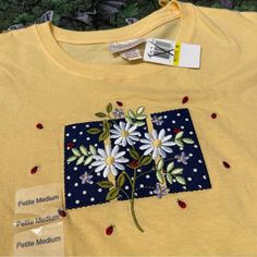 Nwt Top Stitch Morning Sun Tee Medium Petite Yellow With Embroidered Daisies Lady Bugs 100% Cotton Shoulders 16.75”, Sleeves 5.75”, Chest 20”, Length 24.5” Thank You For Viewing This 4th St Find! Yellow Patchwork T-shirt For Spring, Spring Short Sleeve Top With Machine Embroidery, Machine Embroidered Short Sleeve Top For Spring, Short Sleeve Tops With Machine Embroidery For Spring, Spring Cotton Patchwork T-shirt, Spring Cotton Embroidered Crew Neck Top, Spring Cotton Embroidered Top With Crew Neck, Summer Cotton Tops With Machine Embroidery, Casual Cotton Top With Machine Embroidery