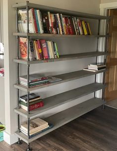 Handmade industrial bookcase with genuine iron pipes, finished in classic gray stain color on pine wood shelving, 6 tier shelving unit with bookcase stacked along the shelves. 72" length and 11" depth. Farmhouse Bookcase, Pipe Bookshelf, Style Shelving, Farmhouse Bookcases, Style Bookcase, Industrial Bookshelf, Bookcase Design, Solid Wood Shelves, Living Room Entertainment