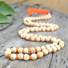 "📿This unique mala is handcrafted with engraved \"HARE RAMA HARE KRISHNA \" wooden beads hand knotted with cotton cord and is finished with a silk tassel. The name of \"RAMA & KRISHNA\" are individually inscribed on each bead which makes this mala very powerful. This mala is sure to help increase your concentration thereby increasing the powers of your prayers.📿. 🖤 MATERIALS 🖤 🌺Wooden Beads (8 MM) 🌺Cotton Cord 🌺Silk Tassels 🖤 PRODUCT DIMENSIONS 🖤 📏Mala Length: 40-42 inches approx ? Hindu Prayer, Hare Rama Hare Krishna, Rama Krishna, Knotted Mala, Silk Tassels, Meditation Beads, Divine Mother, 108 Mala Beads, Red Tigers Eye