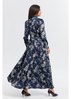 This elegant and sophisticated dress features a beautiful navy and white floral pattern set against a deep black background. The midi-length silhouette offers a flattering fit, with long sleeves and a subtle tie-neck detail for added femininity. The flowy skirt provides a graceful drape, making it perfect for special occasions or everyday wear. It extends 49.5 inches from the high point of the shoulder, offering a flattering midi length. A detached self-belt ensures a perfect fit, while detailed Chic Floral Print Maxi Length Long Sleeve Dress, Chic Long Sleeve Maxi Dress With Floral Print, Long Sleeve Floral Dress For Formal Occasions, Long Sleeve Floral Dress For Casual Occasions, Elegant Floral Dress For Fall, Elegant Long Sleeve Floral Dress For Formal Occasions, Elegant Fall Floral Dress, Elegant Long Sleeve Floral Formal Dress, Elegant Formal Long Sleeve Floral Dress